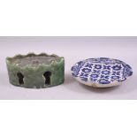 A MOROCCAN GREEN GLAZED POTTERY INKWELL, together with a blue and white glazed pottery dish, inkwell