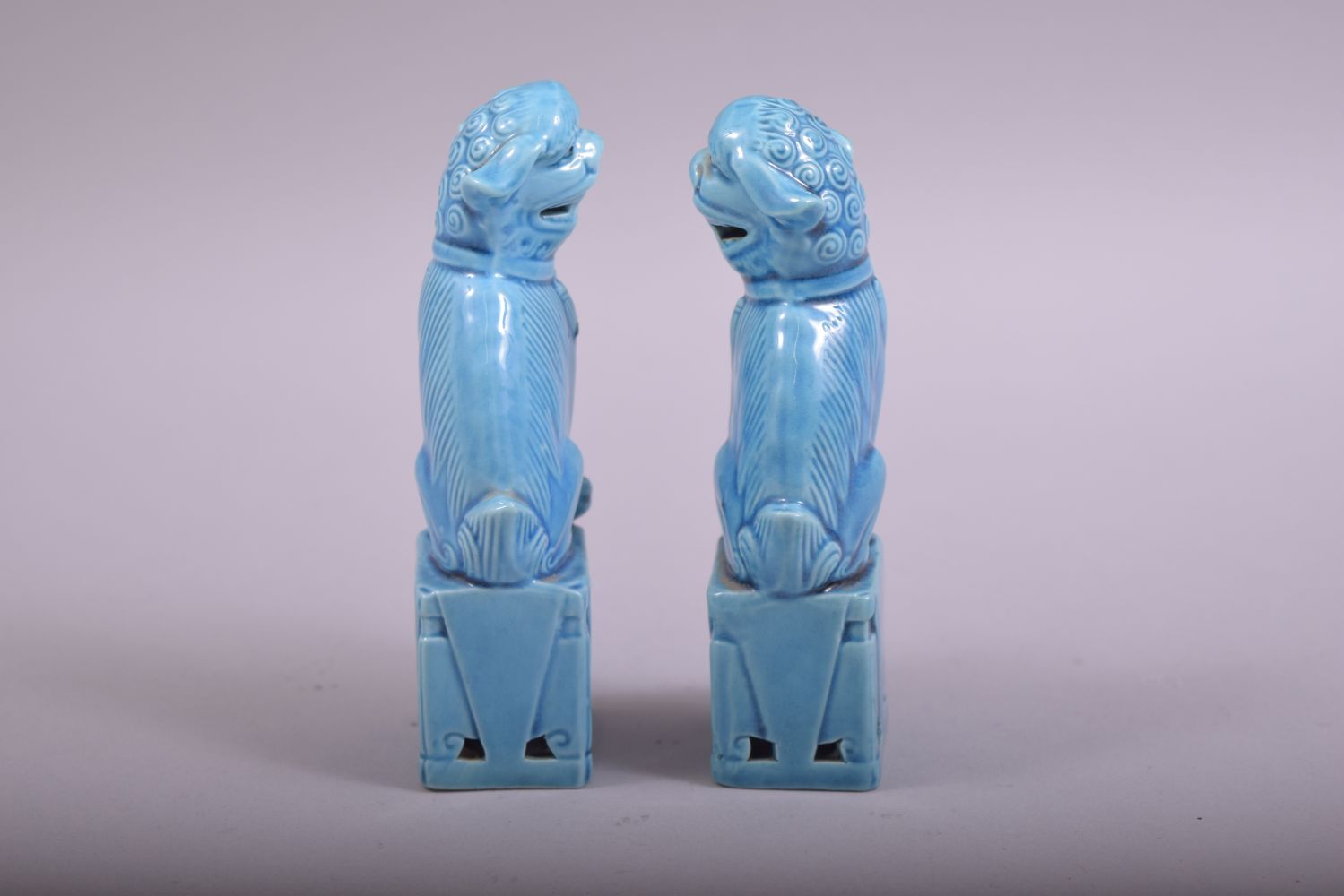 A SMALL PAIR OF CHINESE BLUE GLAZED PORCELAIN KYLIN, 11.5cm high. - Image 4 of 5