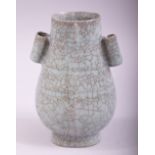 A SMALL CHINESE SONG STYLE TWIN HANDLE CELADON VASE, 12.5cm high.