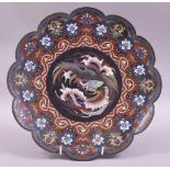 A JAPANESE CLOISONNE PETAL FORM DISH, the centre with a roundel containing a stylised cockerel, 30cm