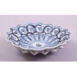 A CHINESE BLUE AND WHITE MING STYLE FLOWER FORMED PORCELAIN DISH, the petals decorated with