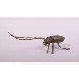 A JAPANESE BRONZE MODEL OF A LONG HORNED BEETLE, with hinged back, 14.5cm long.