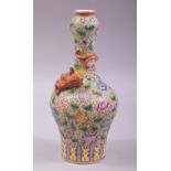 A SMALL CHINESE FAMILLE VERTE PORCELAIN BOTTLE VASE, with a coral red and gilt chilong curled around