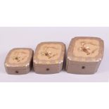 A GRADUATED SET OF THREE JAPANESE SHIBIYAMA DECORATED LACQUER BOXES, diamond shaped, each with