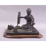 A GOOD JAPANESE BRONZE GROUP modelled as a lady kneeling beside a spinning wheel with a basket of