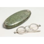A PAIR OF GEORGIAN SILVER SPECTACLES in a shagreen case. Case 5.5ins long.