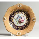 A GOOD COALPORT PLATE painted with flowers. 7.5ins diameter.