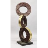 A LARGE BRONZE ABSTRACT MODEL, three rings on a square base. 4ft high.
