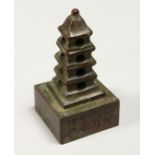 A SMALL CHINESE BRONZE PAGODA SEAL 3ins high.