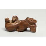 A CARVED WOOD MICE NETSUKE