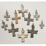 TWO SMALL ROMAN CAST IRON CROSSES.