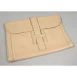 A CREAM LEATHER CLUTCH BAG. 11ins x 7.75ins.