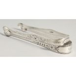 TWO GEORGE III BRIGHT CUT SUGAR TONGS. London 1802, maker Peter, Ann and William Bateman & London