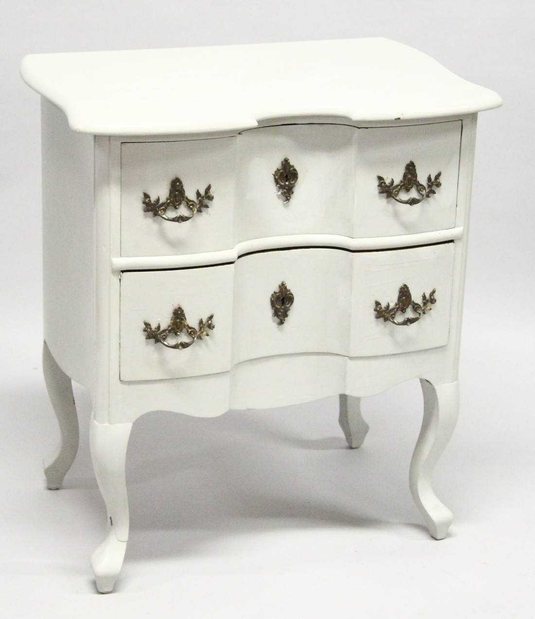 A CONTINENTAL MAHOGANY TWO DRAWER SERPENTINE FRONTED CHEST on cabriole legs, later painted. 2ft 3ins