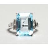 A LARGE, BLUE, TOPAZ AND DIAMOND 18CT GOLD RING.