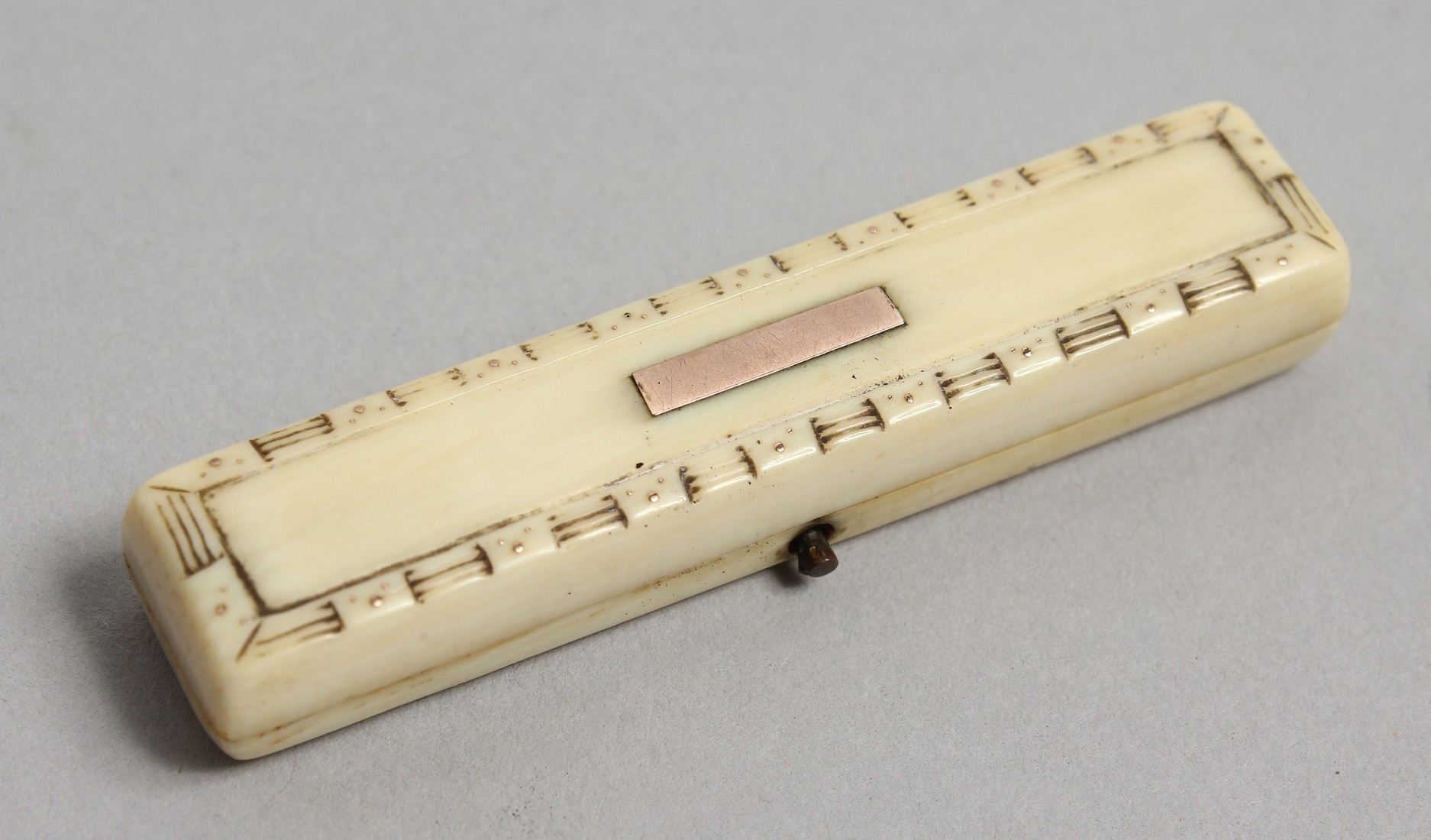 A GEORGIAN IVORY AND GOLD TOOTHPICK CASE. 2.25ins long.