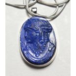 A LAPIS PENDENT on a 14ct white gold chain.