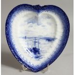 A ROYAL CROWN DERBY HEART SHAPED DISH, painted with an estuary scene in blue, by W E J DEAN.