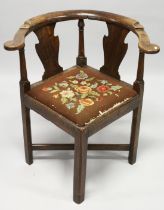 A GEORGIAN CHERRYWOOD CORNER CHAIR with two splats and a drop in needlework seat.
