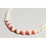 A STRING OF PEARL AND CORAL NECKLACE.
