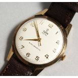 A GENTLEMAN'S GOLD TUDOR ROYAL SHOCK RESISTANCE WRIST WATCH with leather strap, in a Tudor box.