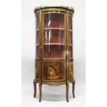 A VICTORIAN LOUIS XV STYLE BOW FRONTED VITRINE with ornate mounts, 3/4 glass doors and sides with