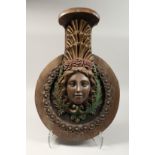 AN 18TH - 19TH CENTURY CARVED WOOD CIRCULAR PLAQUE, a classical female head with maritine rope