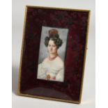 A GOOD MINIATURE OF A LADY in an easel frame. 4ins x 2ins.