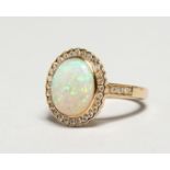 AN 18CT YELLOW GOLD OPAL AND DIAMOND RING