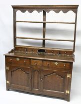 A GOOD 18TH CENTURY OAK DRESSER, the Delft rack with a moulded cornice and shaped frieze over two