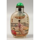 A CHINESE EROTIC REVERSE PAINTED SNUFF BOTTLE. 3.5ins high.