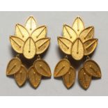 A PAIR OF LISA JACKSON DESIGNER GILT LEAF EAR RINGS