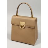 A SALVATORE FERRAGAMO BEIGE LEATHER BAG. 7.5ins with dust cover.