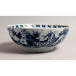 AN 18TH CENTURY ENGLISH BLUE AND WHITE TIN GLAZED CIRCULAR BOWL, the side with a Chinese design.