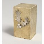 A STUART DEVLIN SILVER BOXED ANGEL AND HOLLY, 1974. 2.5ins.