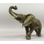 A VIENNA PAINTED BRONZE ELEPHANT, 12ins long.