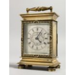 A GOOD SMALL BRASS CLOCK with verge movement, HAM NICHOLLS, CANTERBURY, NO. 2188. 5ins high with