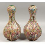 A GOOD PAIR OF BULBOUS OCTANGONAL SHAPED MILLEFIORE DESIGN PORCELAIN VASES.