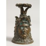 A CLASSICAL BRONZE BELL with three faces. 4ins high.