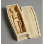 A BONE COFFIN & SKELETON. 4.5ins long.