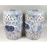 A PAIR OF CHINESE BLUE AND WHITE BARREL SEATS, 17ins high.