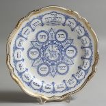 A SPODE BONE CHINA PASSOVER PLATE in blue with gilt borders. 10.5ins diameter.