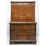 AN 18TH CENTURY WALNUT ESCRITOIRE, with a frieze drawer above the fall flap, enclosing a small