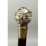 A CARVED BONE HANDLED WALKING STICK, with globe compass,. 37ins long.
