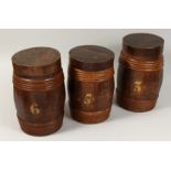 THREE WOODEN BARRELS AND COVERS, Nos.3-5-6. 21ins high.