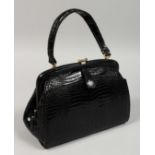 A BOB BLACK CROCODILE BAG. 9ins long.