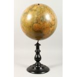 A GLOBE TERRESTRE by A. BENOITS & CO. PARIS. 12ins diameter on a wooden stand.