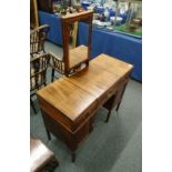 A GILLOWS GENTLEMAN'S MAHOGANY DRESSING TABLE, with rising mirror and flaps opening to reveal
