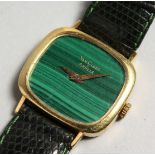 AN 18CT GOLD MALACHITE DIAL VAN CLEEF WRIST WATCH, with leather strap.