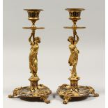 A GOOD PAIR OF 19TH CENTURY, ORMOLU AND CHAMPLINE ENAMEL CLASSICAL CANDLESTICKS, as classical